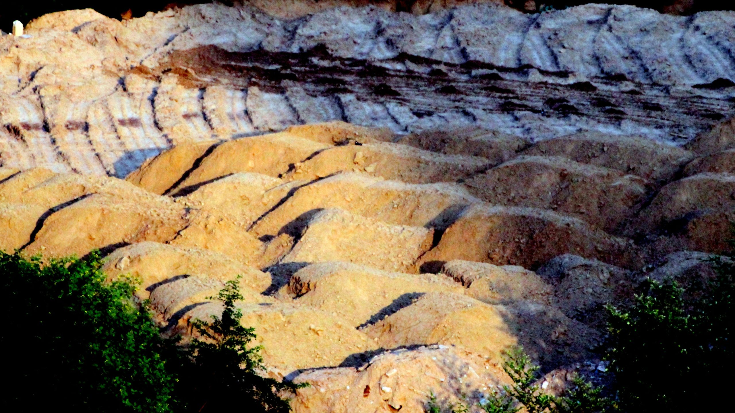 Piles of natural stone slabs in a quarry ready for transport