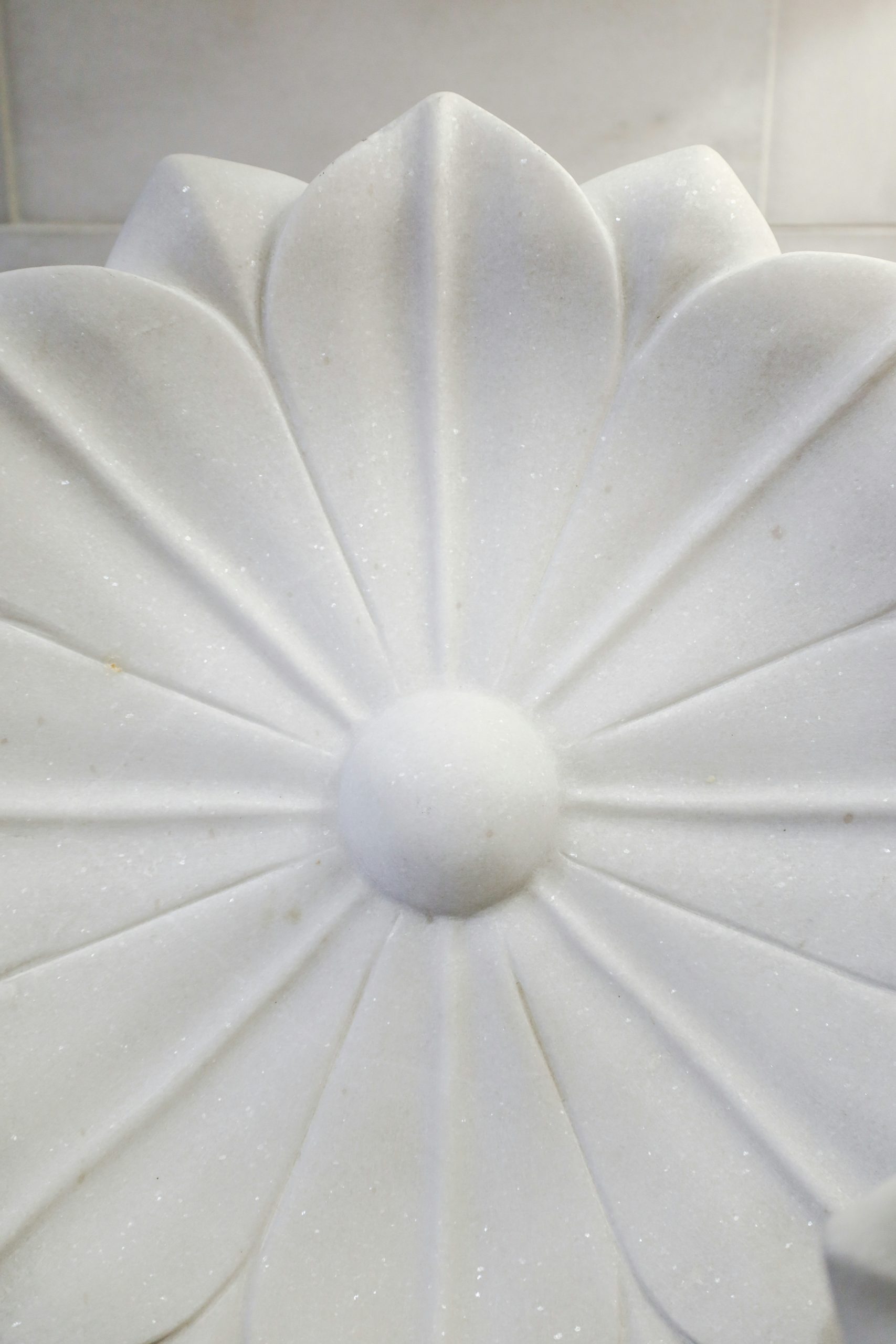 Elegant modern kitchen with white marble countertop and splashback