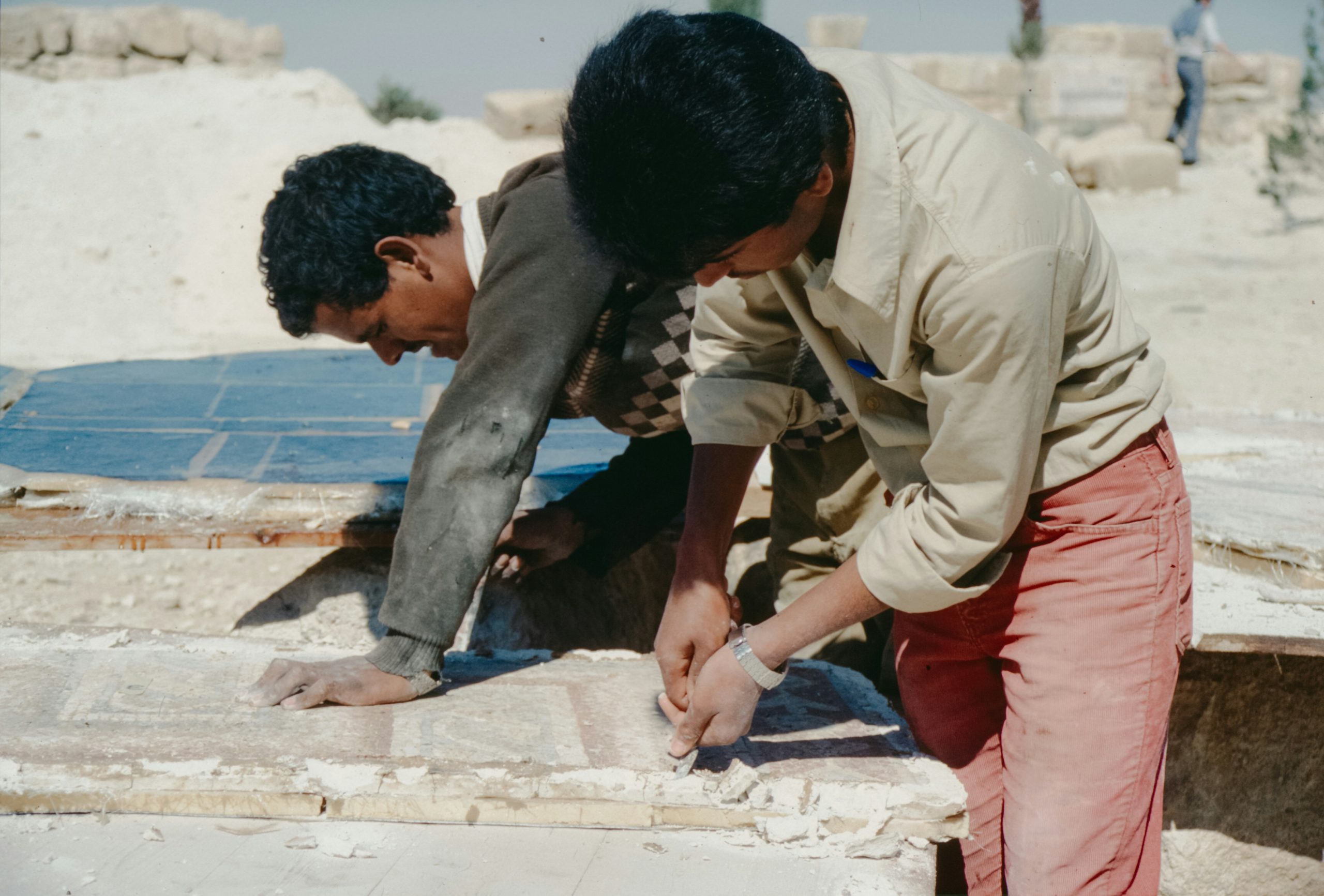 Comparison of varied natural stone textures including simple grey granite versus premium marble slabs