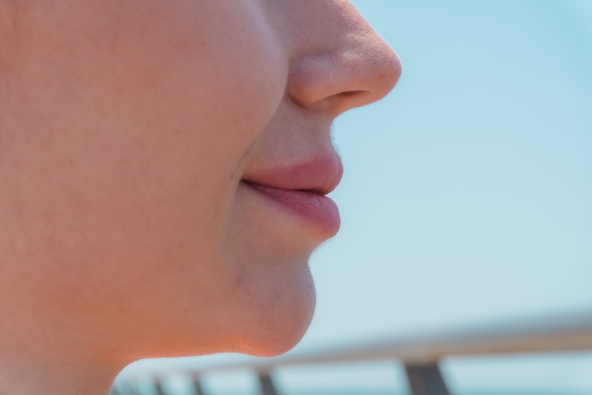 Close-up profile of a young woman's lips