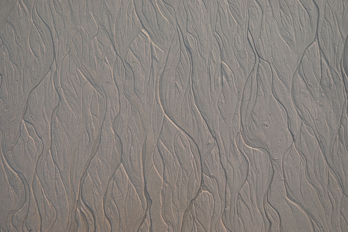 a close up view of sand and water