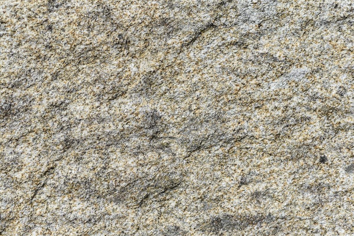 a close up of a rock surface with small rocks