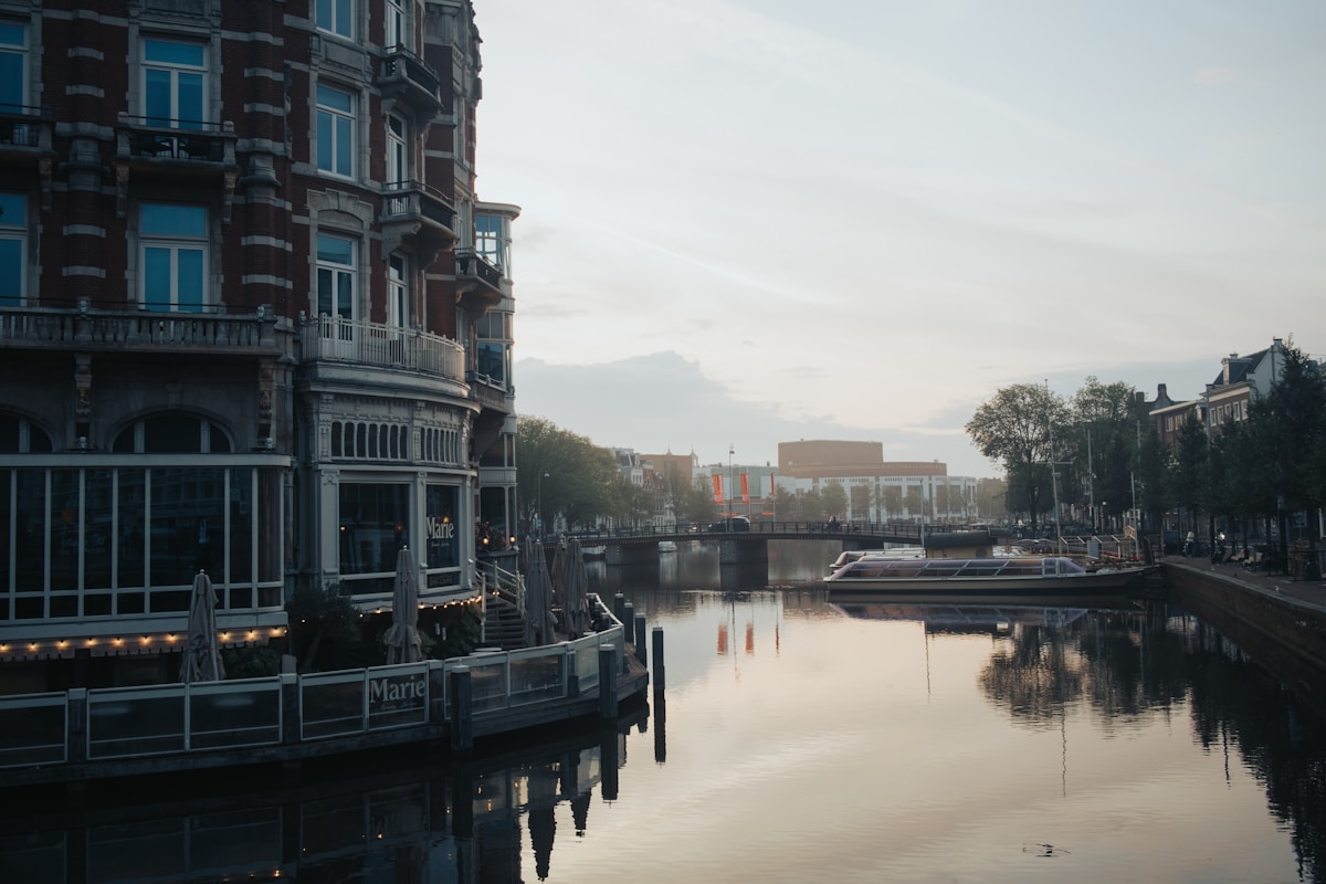 body of water between buildings during daytime
