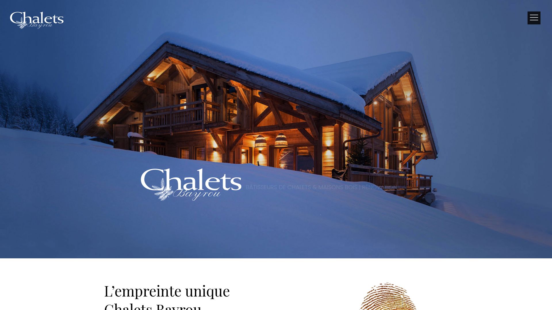 Chalets traditionnels en pierre et bois dans un paysage montagneux.