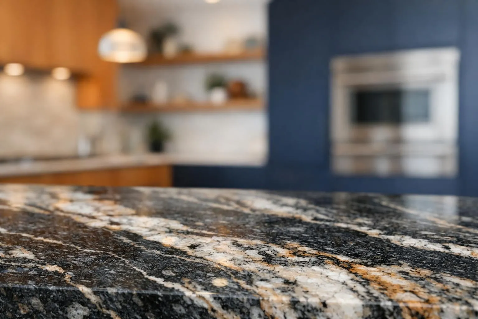 Close-up of a luxurious granite kitchen countertop showing natural veining patterns and polished surface, with a modern kitchen setting visible in soft focus background, emphasizing the stone's authentic texture and premium quality
