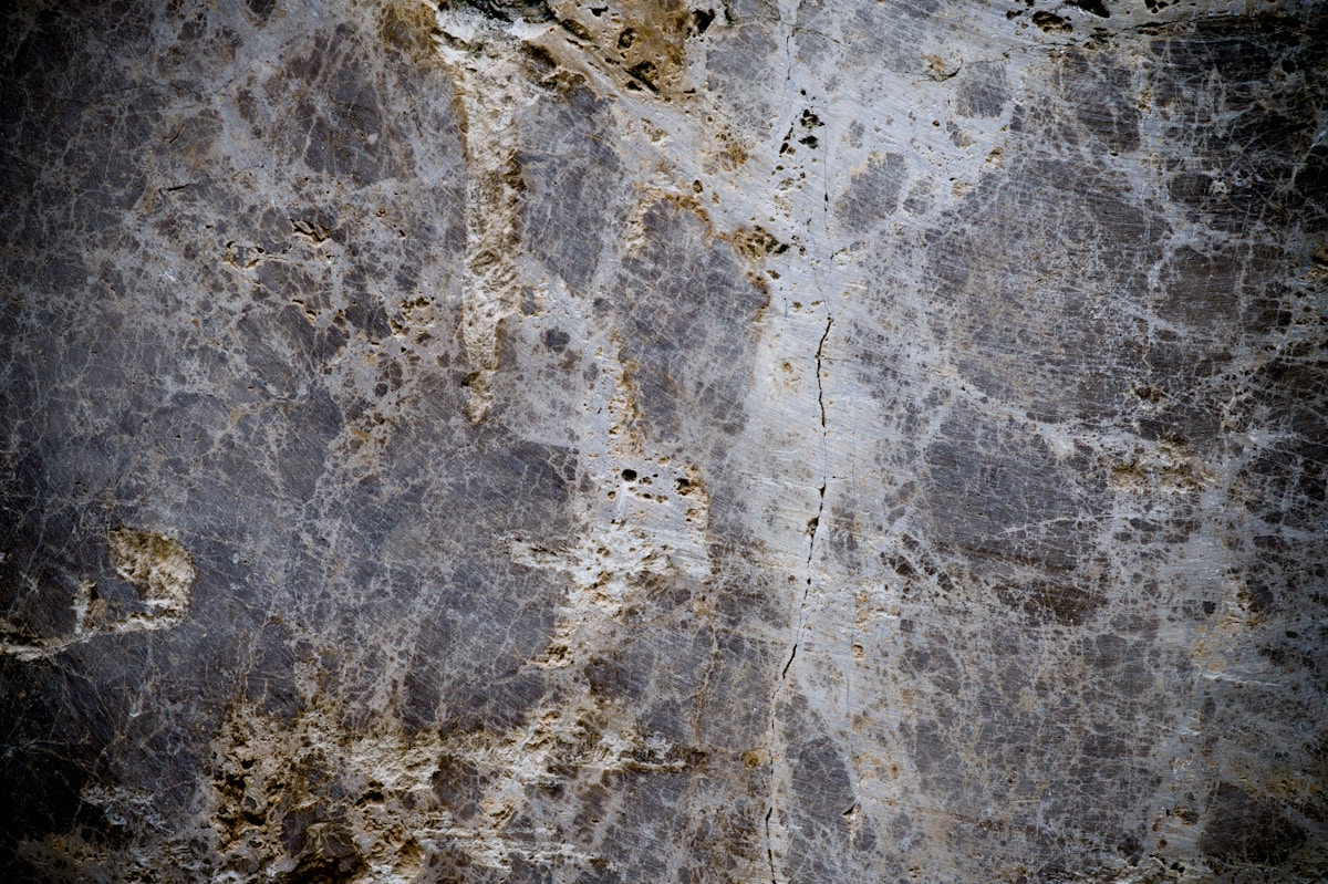 Close-up of a grey marble surface with white veins
